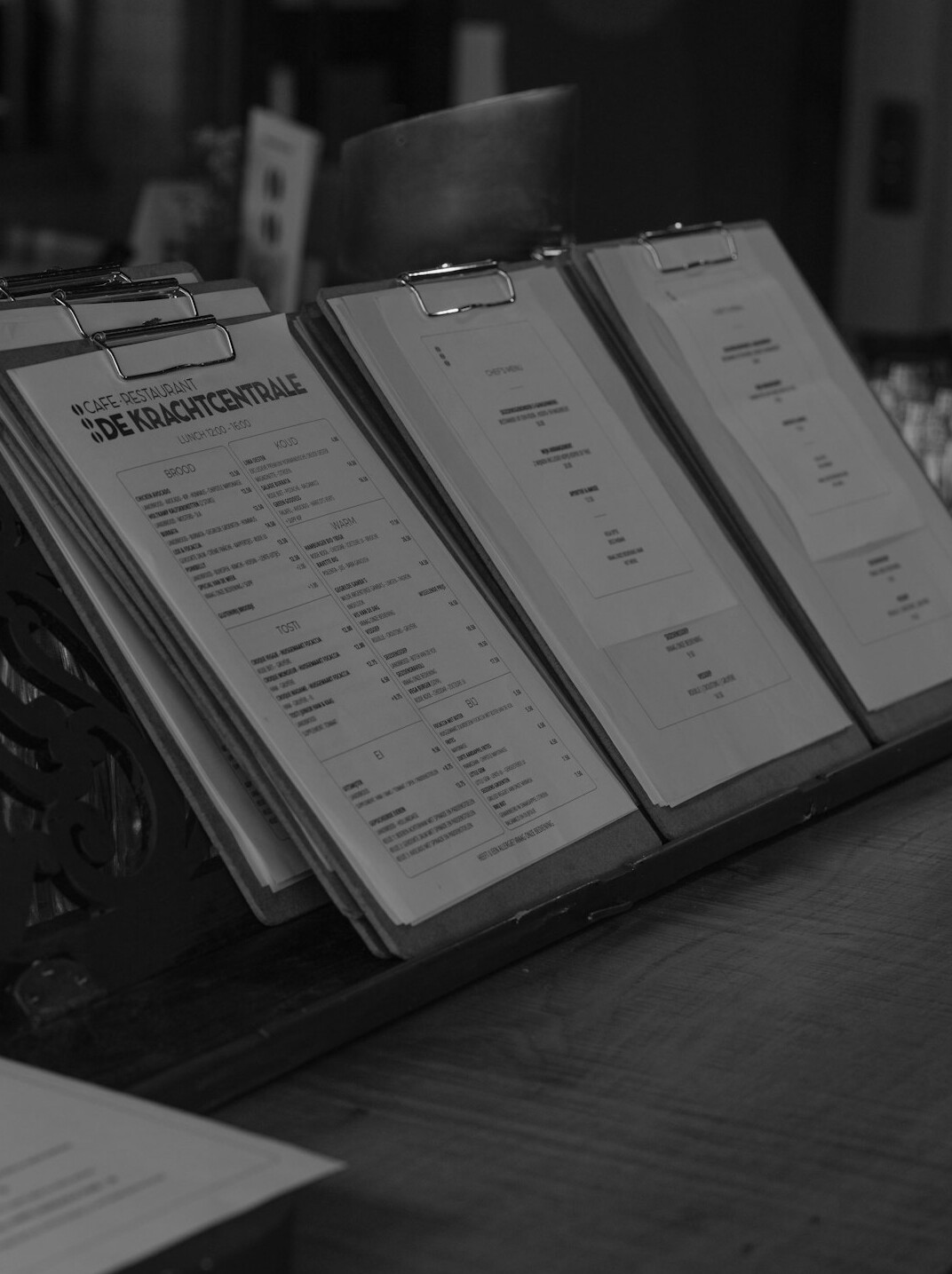 Close-up of hands reviewing printed financial documents and reports on a desk